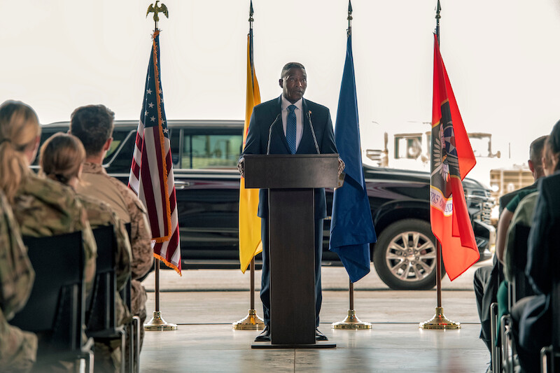 Carl Lumbly as Langdon stands at a podium in Season 1 of 'Obliterated.'
