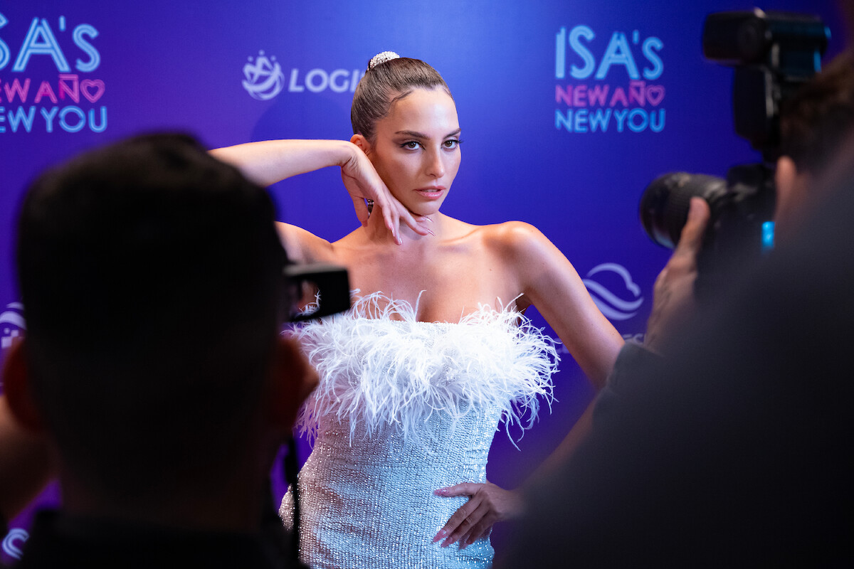 Genesis Rodriguez as Isa poses for photographers in Season 1 of ‘Neon.’