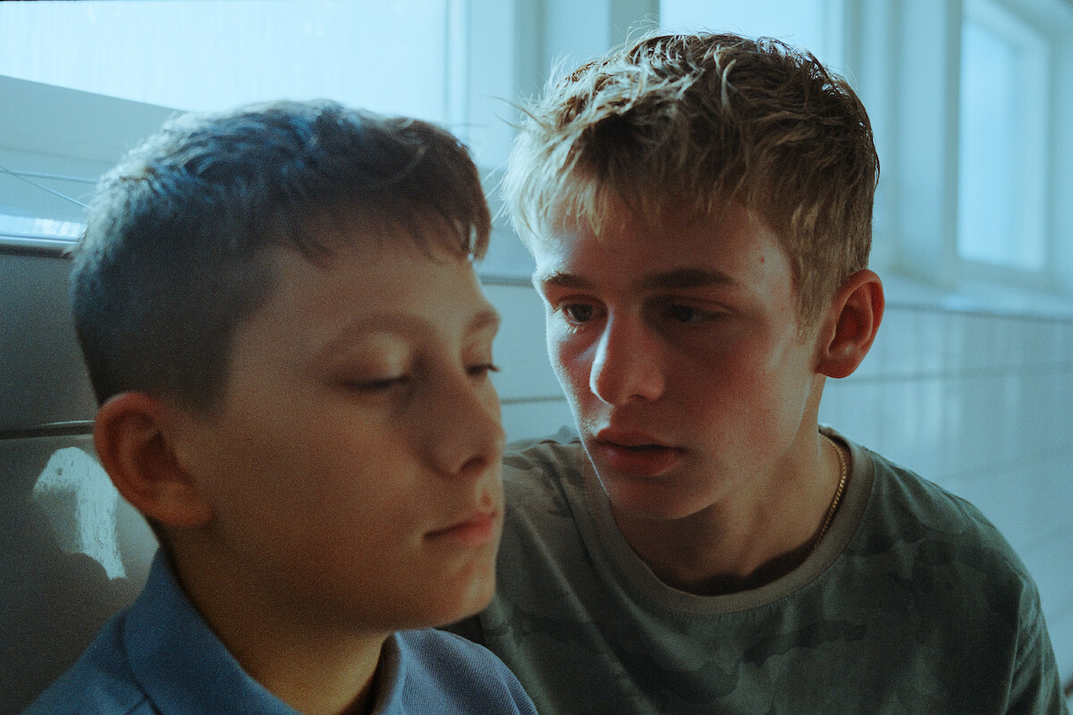 Lukas Zuperka as Viggo looks intensely at Frode Bilde Rønsholt as Oscar in an image from the series ‘Secrets We Keep.’