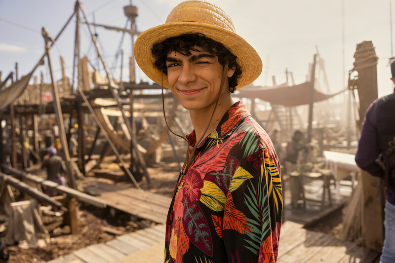 Iñaki Godoy as Monkey D. Luffy smiles at the camera on the set of Season 1 of 'One Piece.'