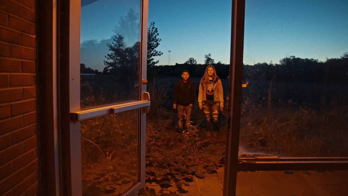 Nikki and Alexa standing outside the doors of The Academy at Ivy Ridge.