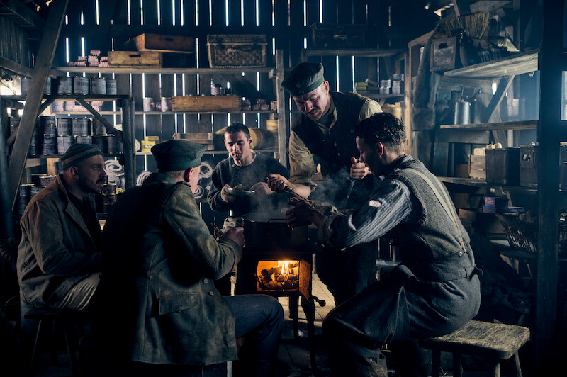 A group of soldiers gather for a meal in ‘All Quiet on the Western Front.’ ‘All Quiet on the Western Front’ First Look Photos