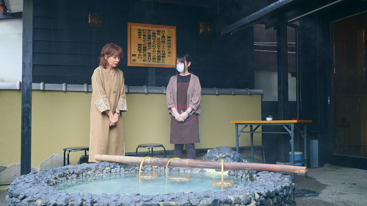 Women about to go into the bathhouse