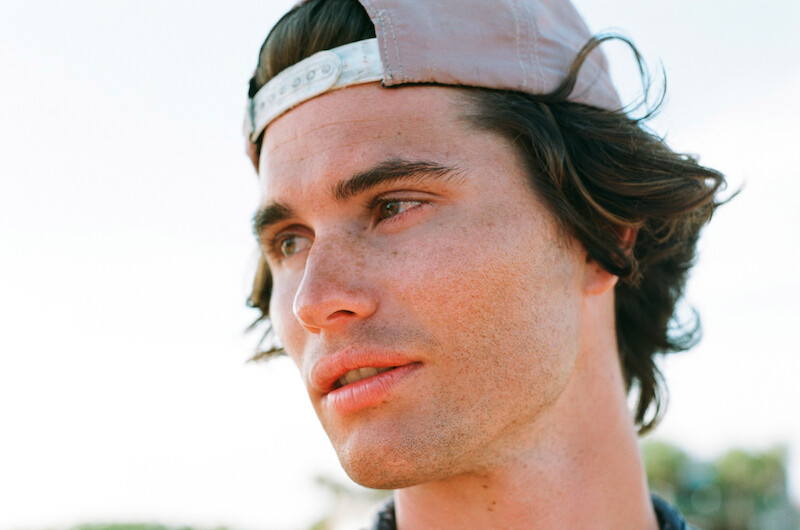 Chase Stokes in Outer Banks Season 1 Behind-the-Scenes Photo Gallery.