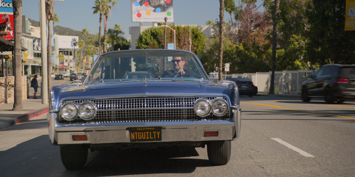 Manuel Garcia-Rulfo as Mickey Haller drives down the Sunset Strip.