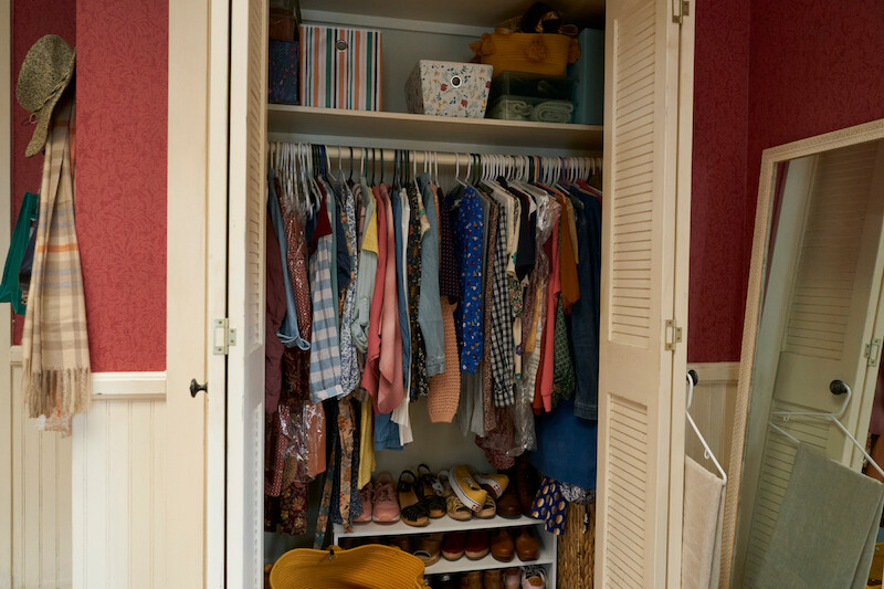Closet packed full with clothes. 