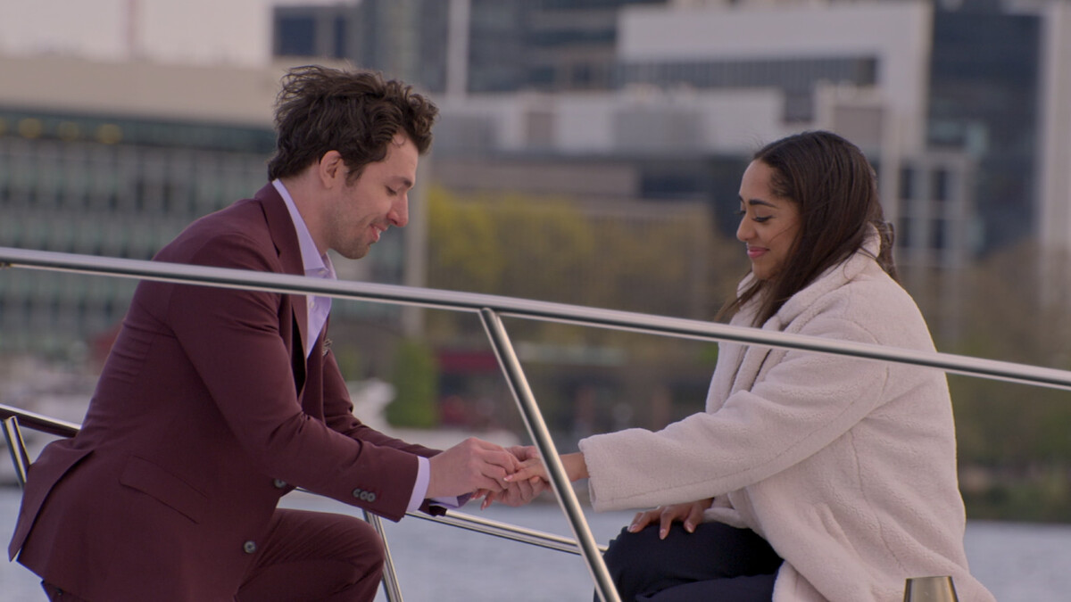 Zack proposing to Bliss on a boat.