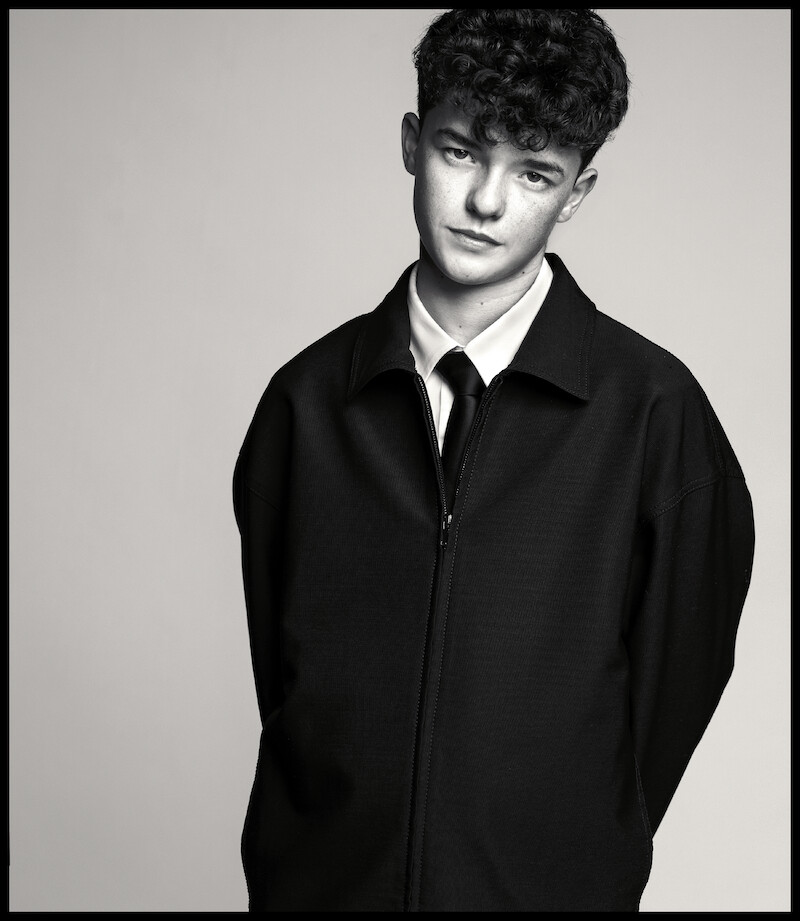 Owen Cooper poses with his hands behind his back.