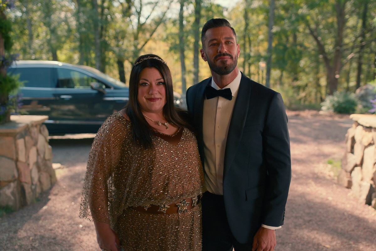 Brooke Elliott as Dana Sue and Brandon Quinn as Ronnie stand together in formal clothing in Season 3 of ‘Sweet Magnolias.’