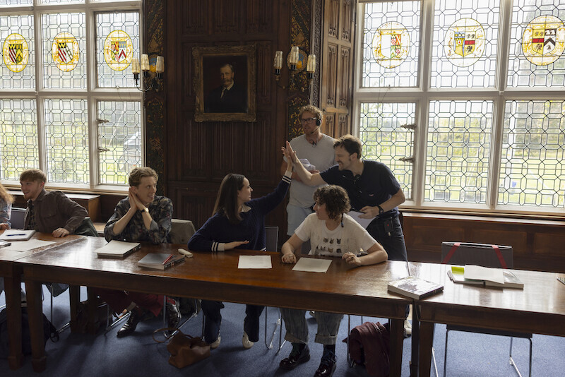 Harry Trevaldwyn as Charlie, Sofia Carson as Anna, Esmé Kingdom as Maggie, and director Iain Morris on the set of 'My Oxford Year'.
