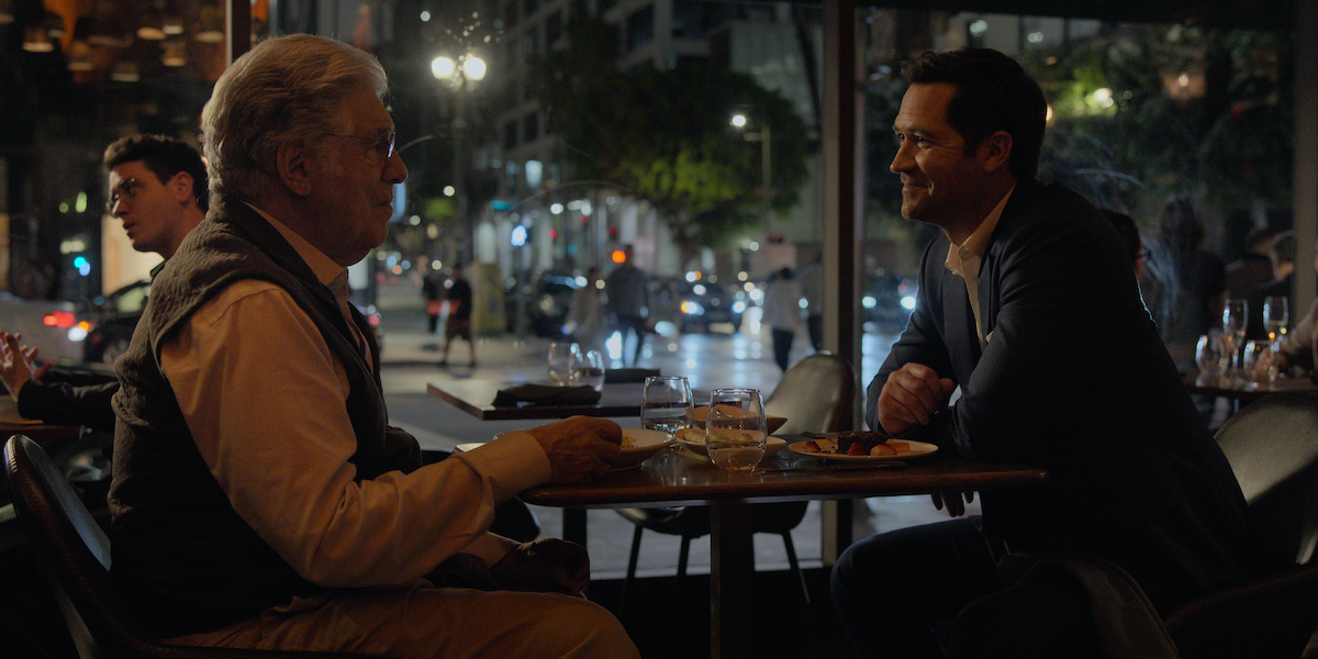 Elliott Gould as Legal Siegel and Manuel Garcia-Rulfo as Mickey Haller having dinner at Le Grand Restaurant