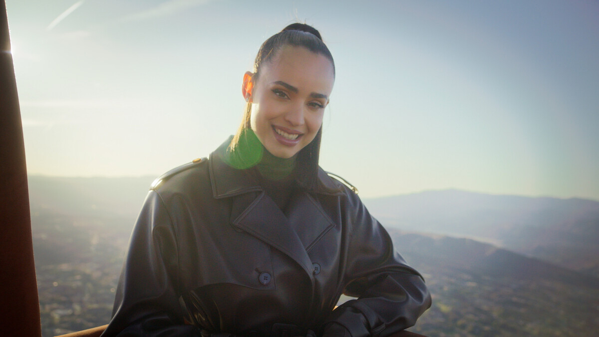 A still of Sofia Carson in a hot air balloon.