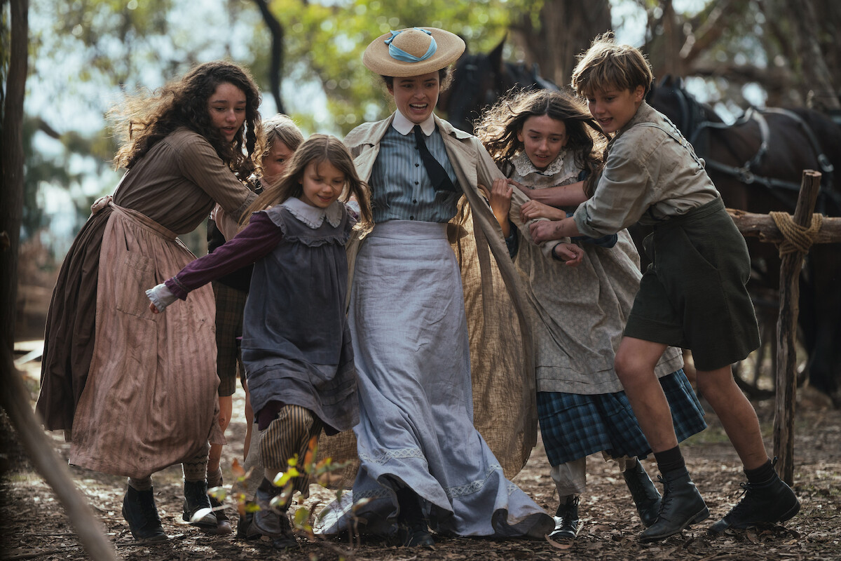 Philippa Northeast as Sybylla Melvyn surrounded by a group of children in an image from ‘My Brilliant Career’