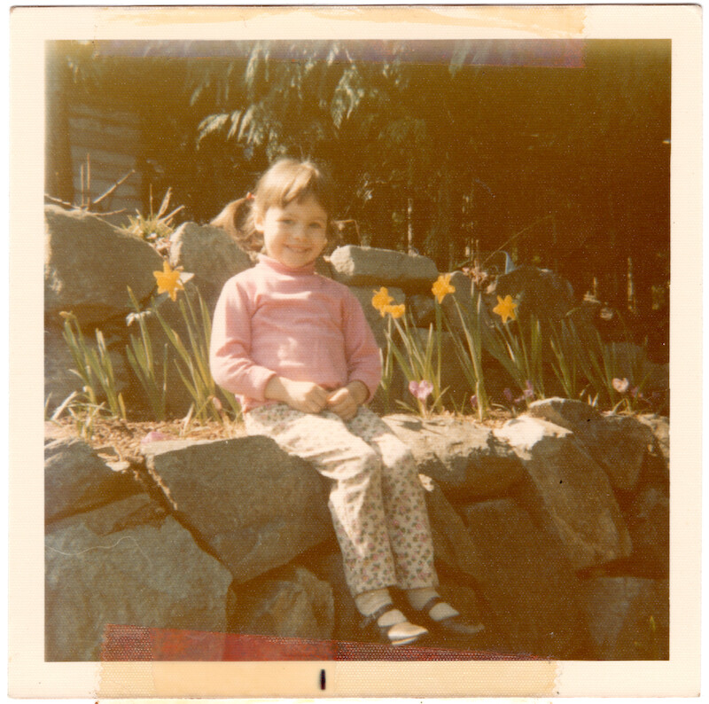 Pamela as a child in pigtails.