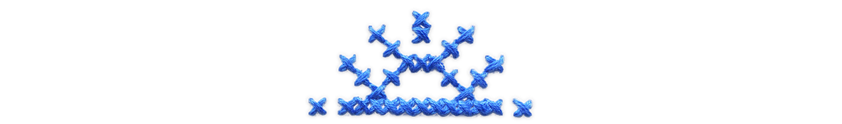 Blue cross stitched sun.