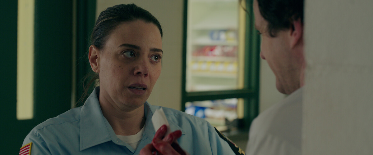 Barbara the prison guard looks at someone off screen