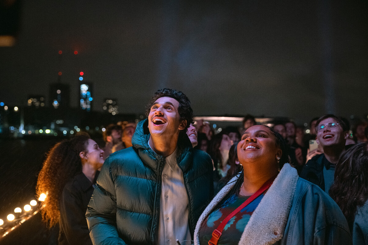 Shahine El-Hamus as Amir and Isabelle Kafando as Ima stand outside and look up at the sky in ‘Crypto Boy’ 