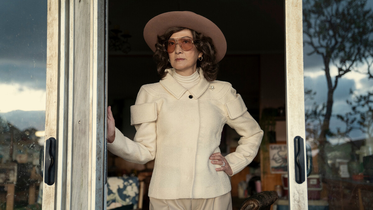 Rosalind Chao as Zhang stands in a doorway wearing a cowboy hat in Season 3 of ‘Sweet Tooth.’