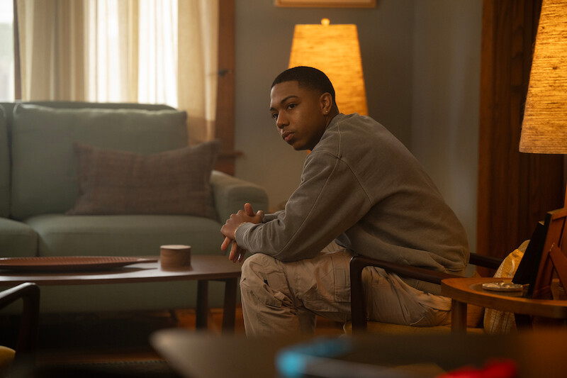 Thaddeus J. Mixson as Demetrius sits in a living room in Season 1 of ‘The Madness.’