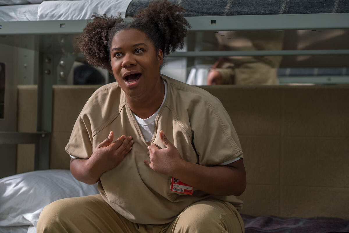 Adrienne C. Moore as Black Cindy sits on a prison bunk bed in Season 4 of Orange Is the New Black.  