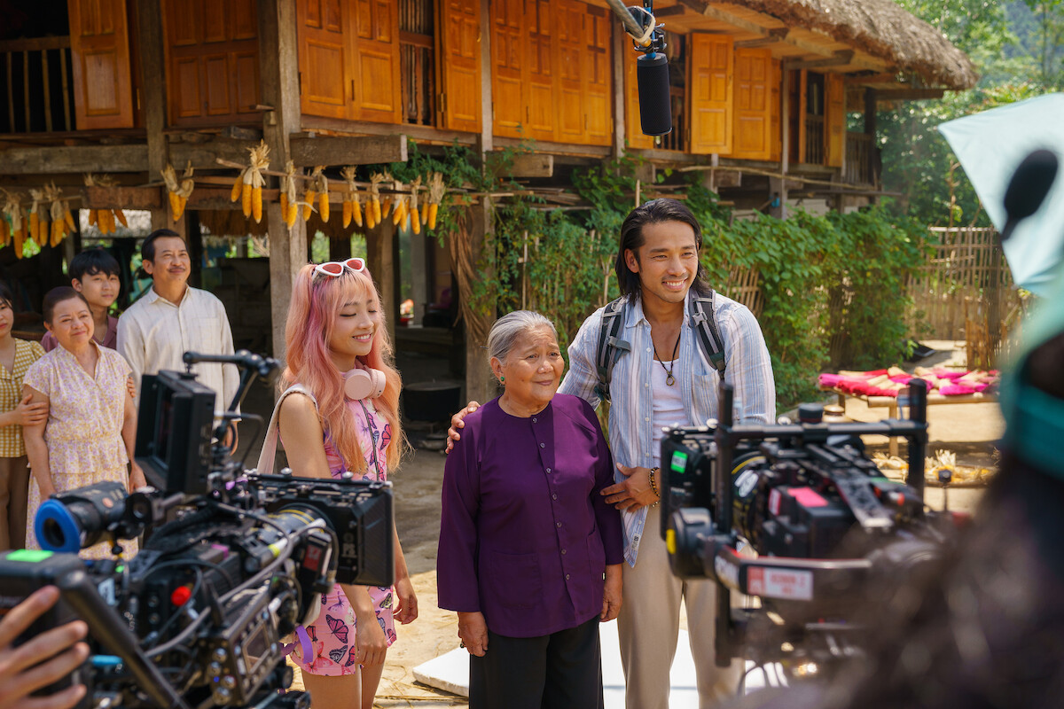 Scott Ly, Quinn Trúc Trần and Nsưt Lê Thiện film a scene in a rural area of Ha Giang.