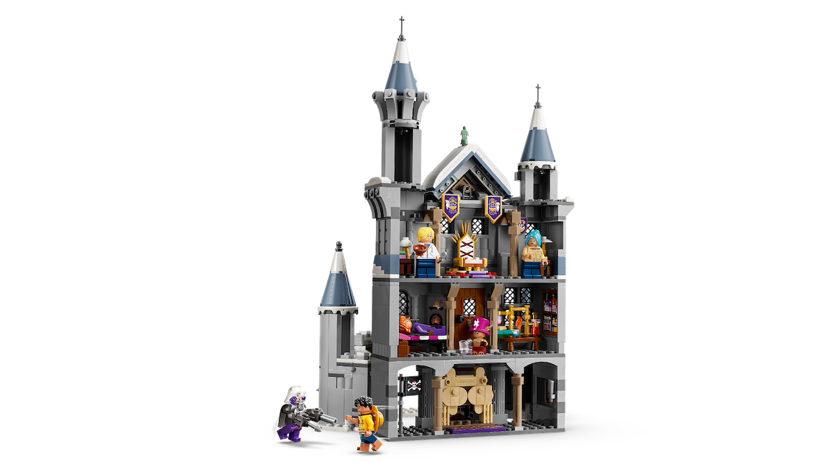 LEGO ONE PIECE Battle at Drum Castle set with multiple mini-figures inside and outside, featuring detailed rooms, towers, and accessories, displayed against a plain background.