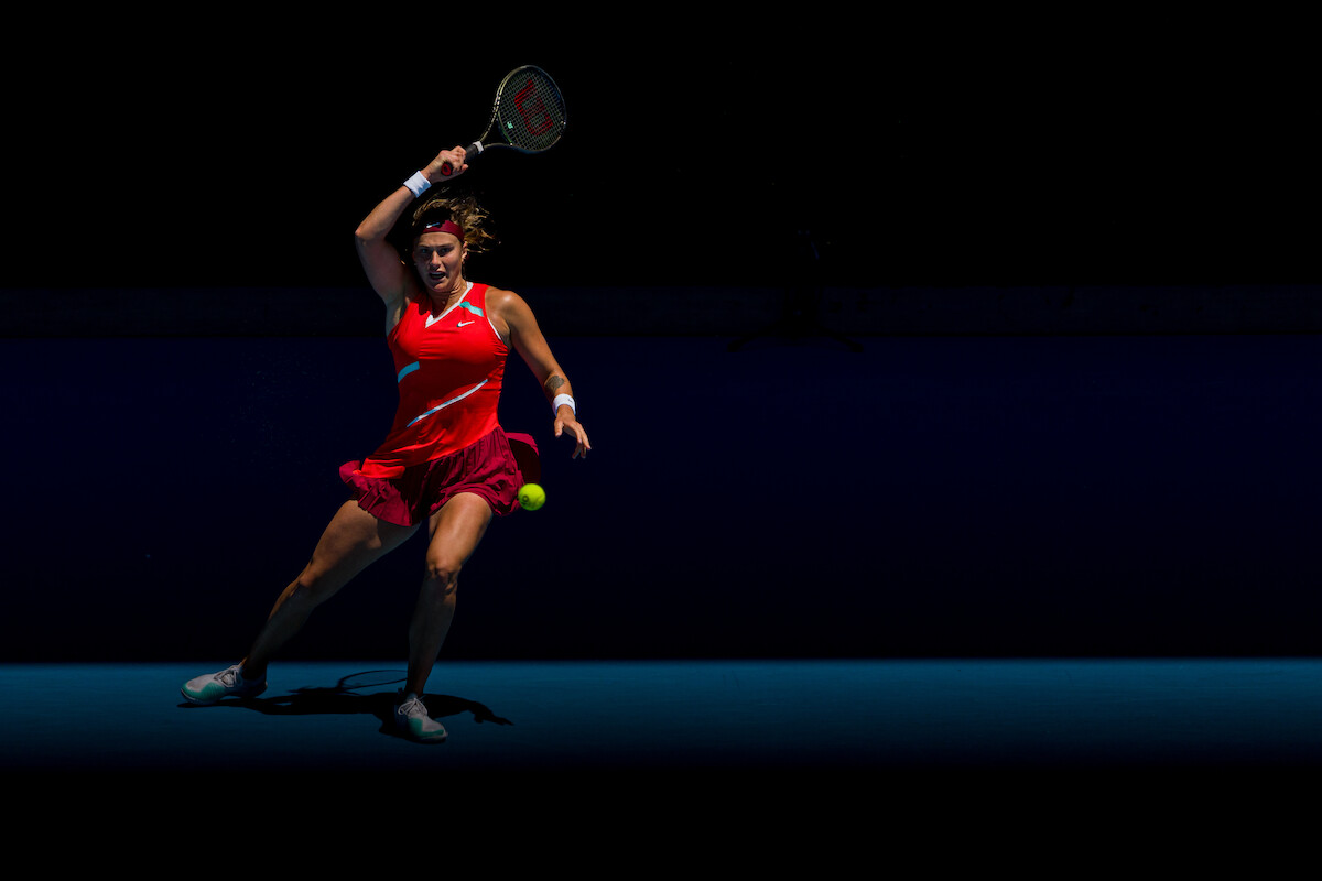 Aryna Sabalenka plays a backhand in her second round singles match against Xinyu Wang.