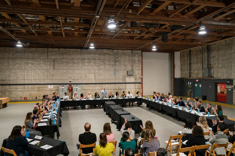The cast and crew at the table read for The Residence. 