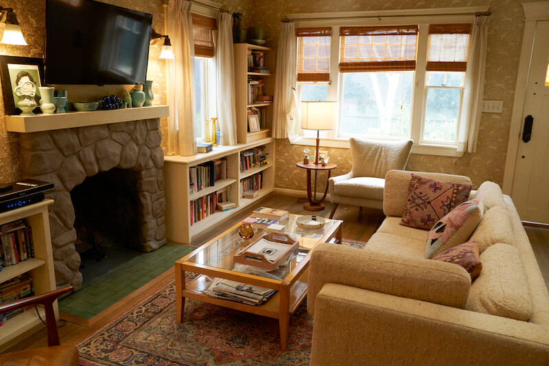 Cozy living room with stone fire place.