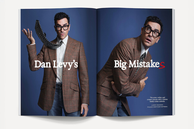 Man in brown plaid blazer and glasses poses in studio on magazine spread with blue background; left side shows him tossing a phone, right side features a contemplative pose. Text overlays read “Dan Levy’s Big MistakeS.”