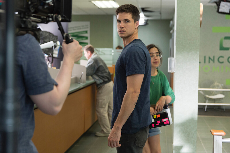 Behind the scenes shot of crew working with Robbie Amell as Connor Reed in 'Code 8'