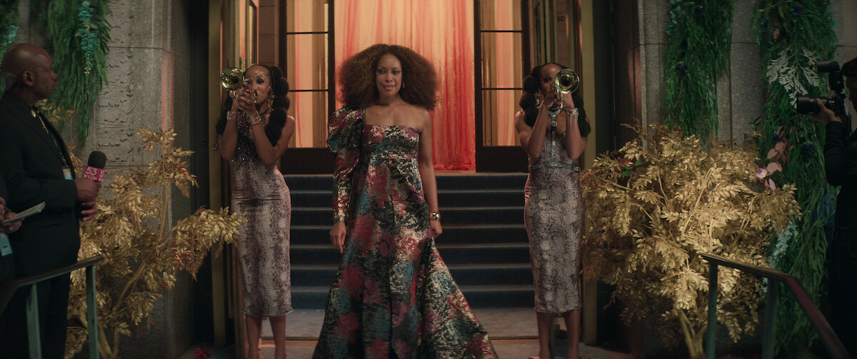 Gina Torres wears a one-shouldered gown at Darzine’s Gala in a still from ‘The Perfect Find.’