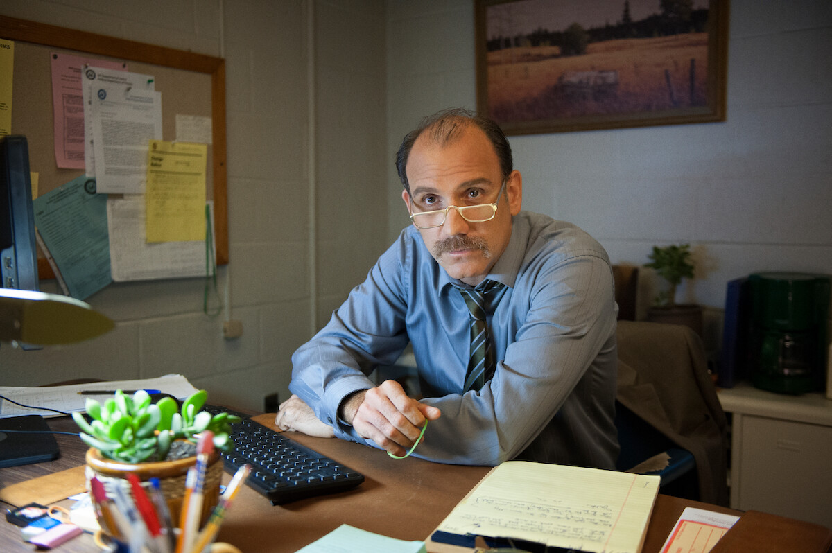 Nick Sandow as Caputo works in his office in Season 1 of ‘Orange Is the New Black.’