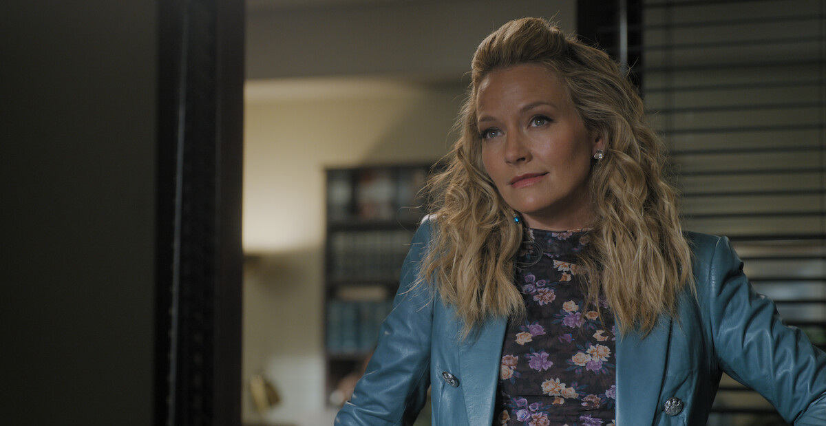 Becki Newton as Lorna Crane in ‘The Lincoln Lawyer’ Season 2, wearing a blue leather blazer.