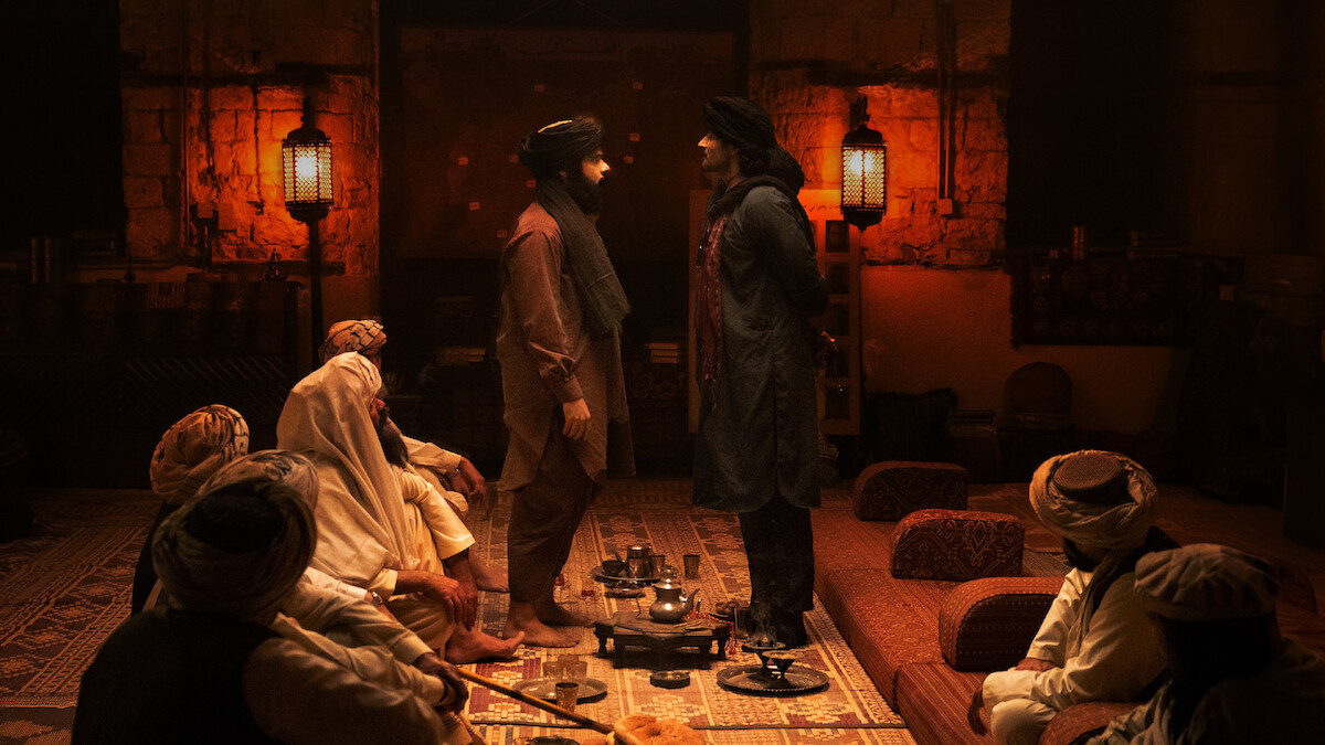 Ali Fazal as Pakistani intelligence agent Kahil Nahir faces off with the leader of a Taliban militia camp in a production still from ‘Kandahar.’
