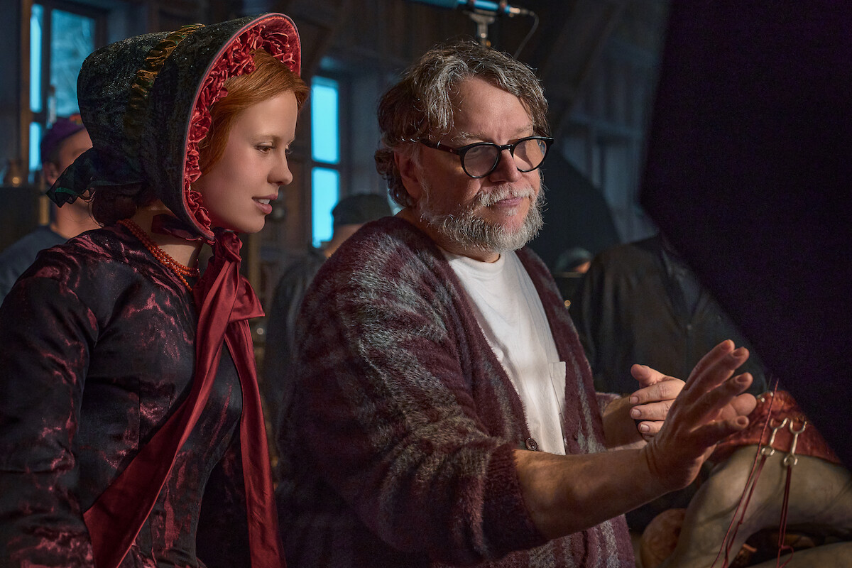 Mia Goth and Guillermo del Toro behind the scenes of Frankenstein