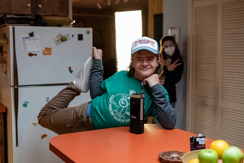 Gaten Matarazzo gets in a stretch before fighting the Upside Down - 68 Behind-the-Scenes pics from ‘Stranger Things’ Season 4 You Have to See Slideshow