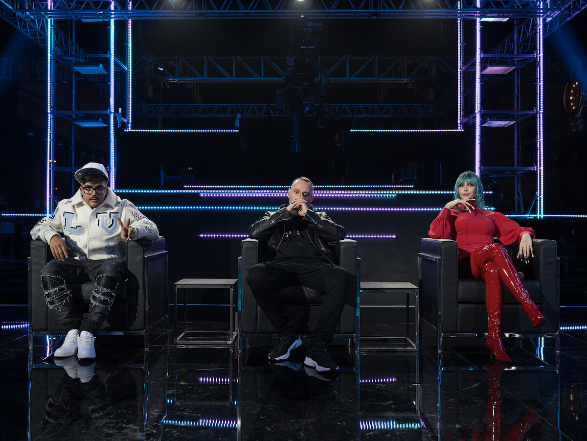 Geolier, Fabri Fibra, and Rose Villain sit on a stage together in season 1 of ‘Rhythm + Flow Italy.’