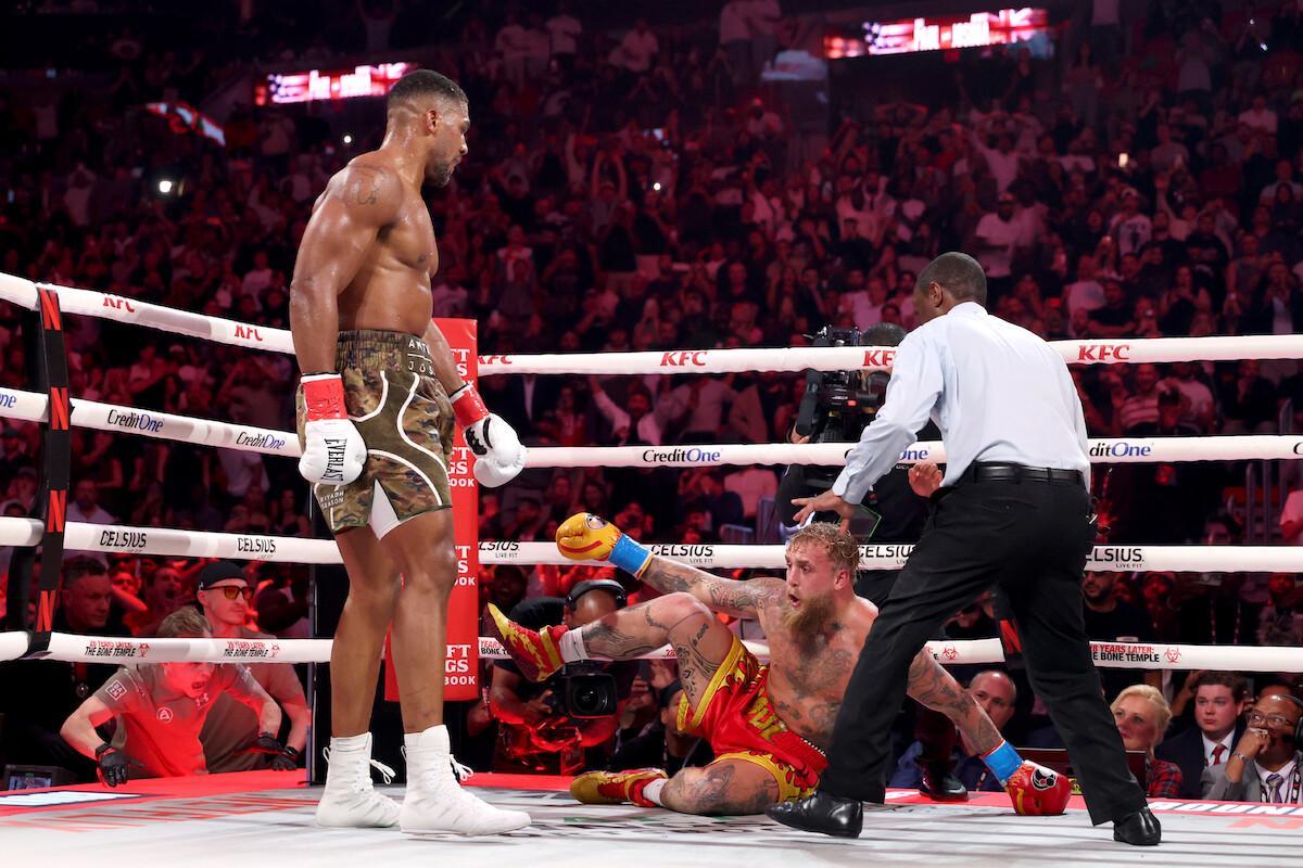 Jake Paul is knocked down against Anthony Joshua in their heavyweight bout.