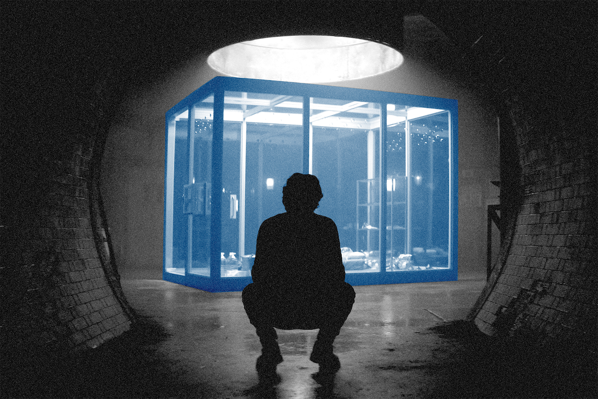 Photo illustration of Joe Goldberg squatting in front of the cage from You
