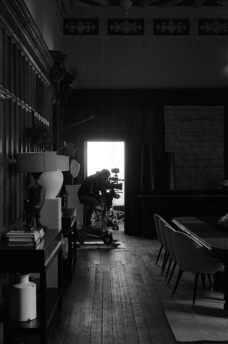 Black-and-white image of crew operating a camera in Season 1 of 'Fool Me Once'