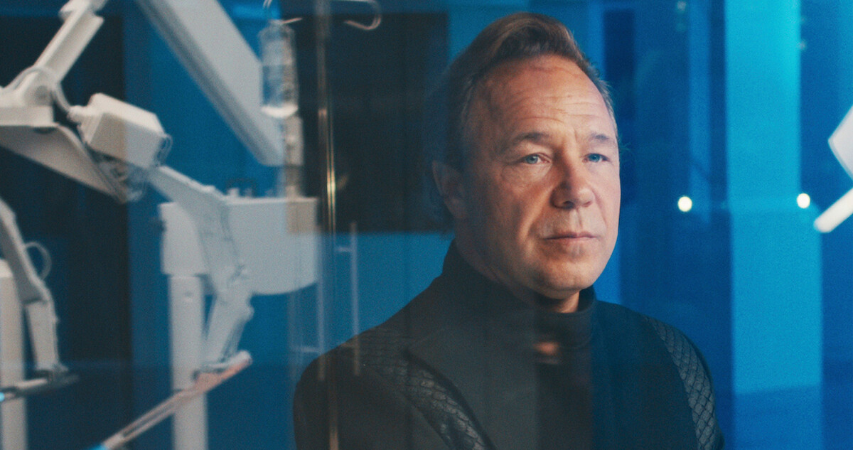 Stephen Graham as Elias Mannix stands in a lab in 'Bodies.'