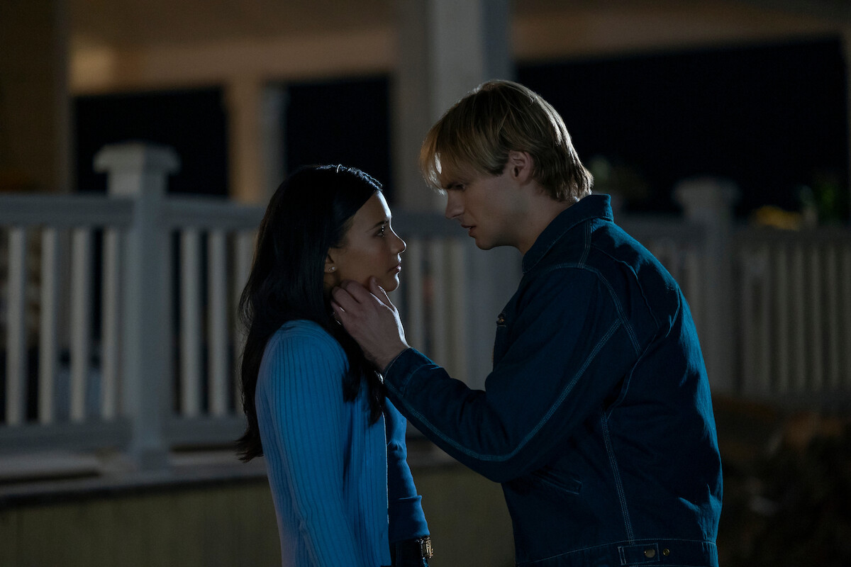 Noah LaLonde as Cole holds Nikki Rodriguez as Jackie’s face in ‘My Life with the Walter Boys’ Season 2.