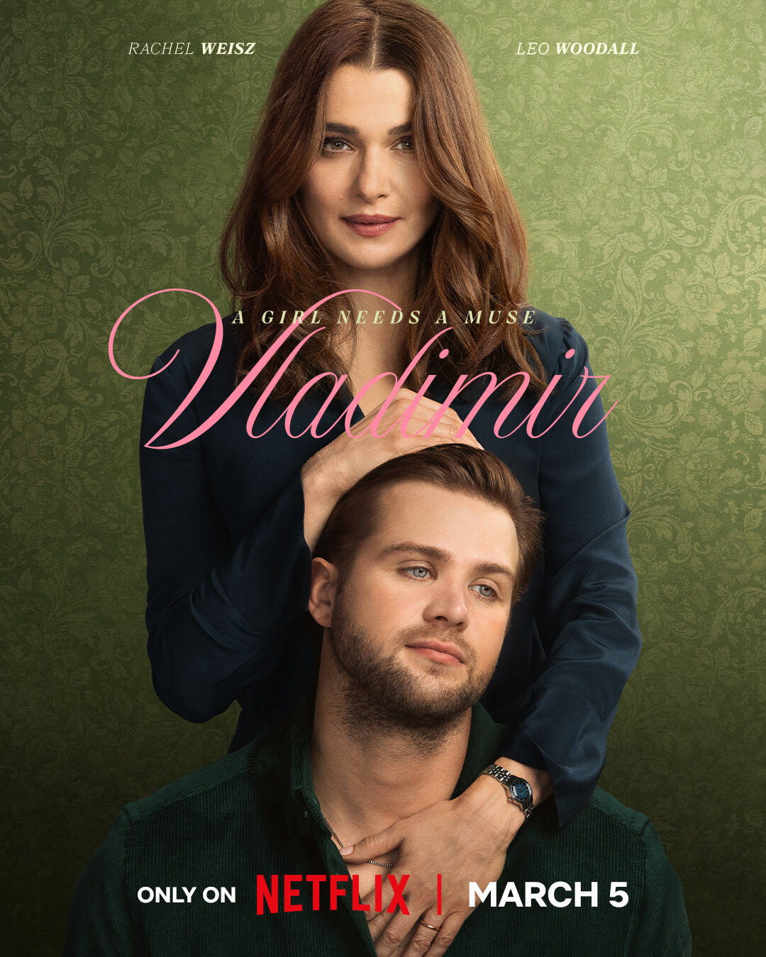 A woman with long brown hair gently rests her hands on a younger man’s head; both pose against an ornate green patterned backdrop. The image has text featuring names and the title "Vladimir" in elegant font on the foreground.