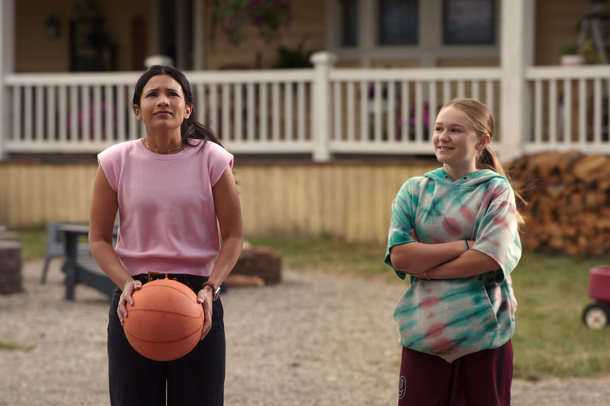 Nikki Rodriguez as Jackie and Alix West Lefler as Parker play basketball in ‘My Life with the Walter Boys’ Season 2.