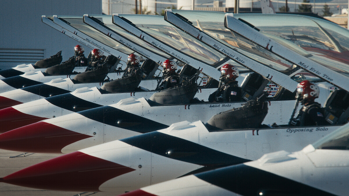 A row of parked fighter jets