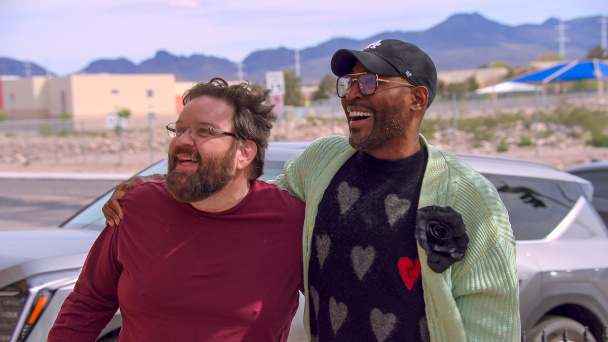 Karamo Brown with his arm around Sean Critchfeld