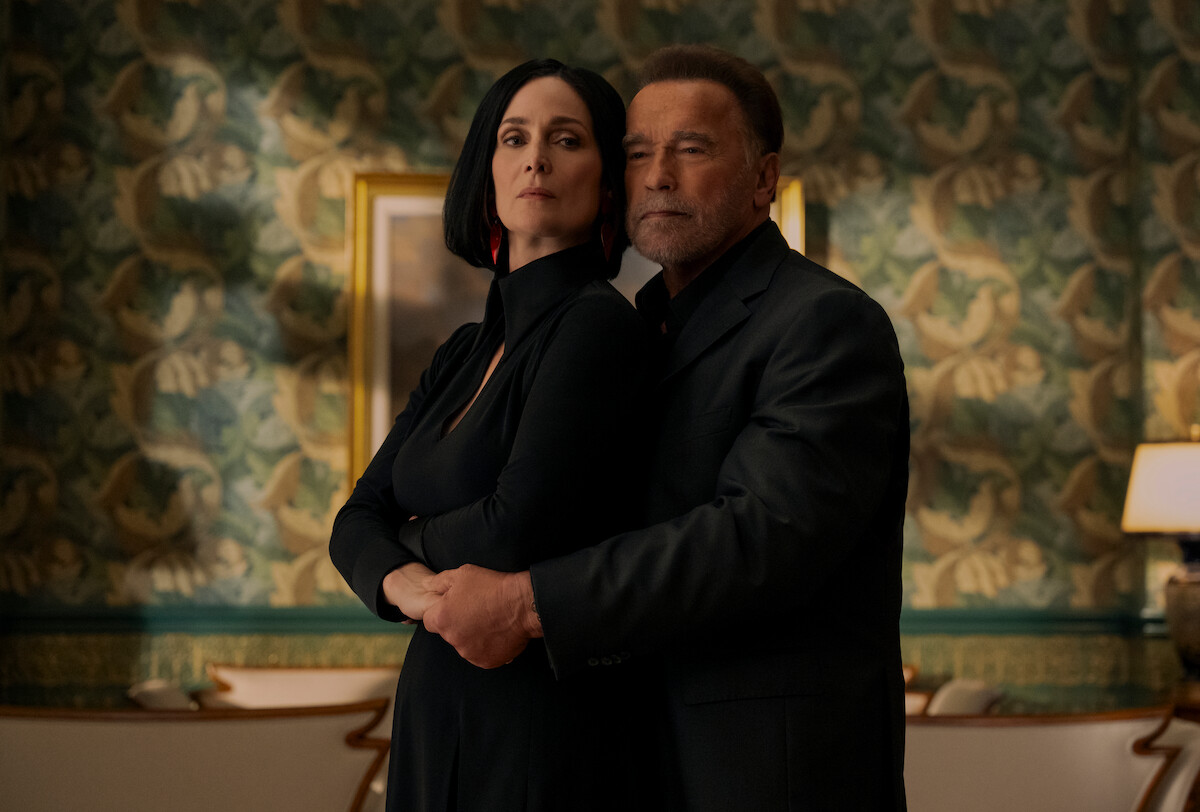 Carrie-Anne Moss as Greta Nelso and Arnold Schwarzenegger as Luke Brunner in ‘FUBAR’ Season 2.