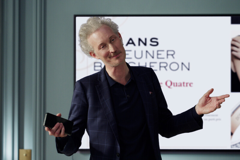 Bruno Gouery as Luc shrugs in Season 4 of 'Emily in Paris'