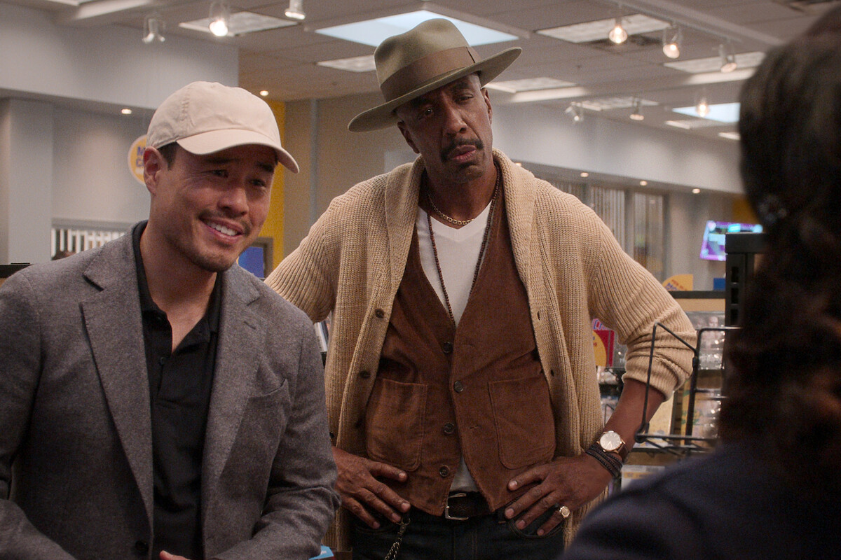 two men in hats standing in a Blockbuster video